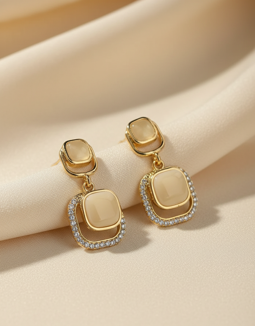 Affordable gold-plated earrings featuring premium white zircon stones.